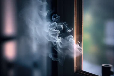 Smoke escaping from the window: An air purifier effectively removing smoke particles from indoor air near a window