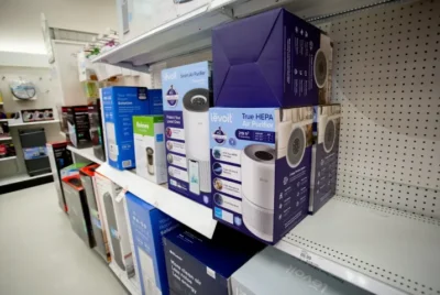 How to clean a Levoit air purifier: A display of various Levoit air purifier models at a department store