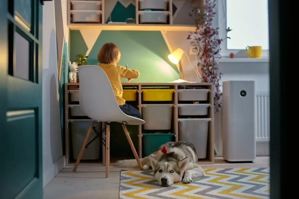 Pet dog and air purifier in a children's room 