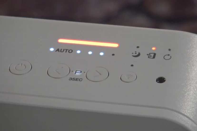 Close-up of Winix air purifier control panel with blinking red light
